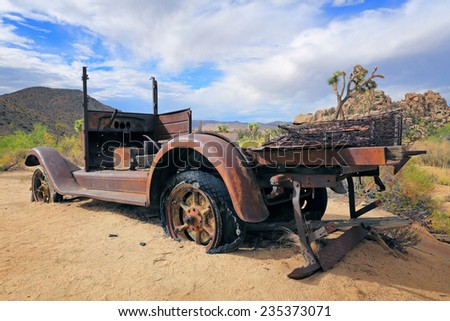 A very old car lies rusting in the Mojave Desert at Joshua Tree National Park in California.