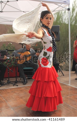 PHOENIX, AZ - NOVEMBER 14: Flamenco dancer Yumi La Rosa, headline performer with Mosaico Flamenco music and dance company, performs at the Desert Botanical Garden Nov. 4, 2009 in Phoenix, Arizona.