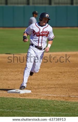 PHOENIX, AZ - OCTOBER 19: Tyler Pastornicky, a top Atlanta Braves prospect, rounds third base in an Arizona Fall League game on Oct. 19, 2010 at Phoenix Municipal Stadium in Arizona.