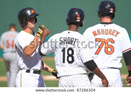 MESA, AZ - OCTOBER 17: Arizona Fall Leaguers Brandon Short (White Sox) and Joe Mahoney (Orioles) celebrate Jarek Cunningham's (Pirates) 3-run homer on Oct. 17, 2011 at HoHoKam Stadium.