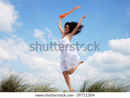 Happy woman jumping for joy