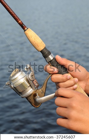 fishing rod and reel. a fishing rod and reel