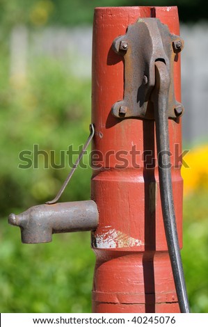 Closeup of an old hand water pump for a well