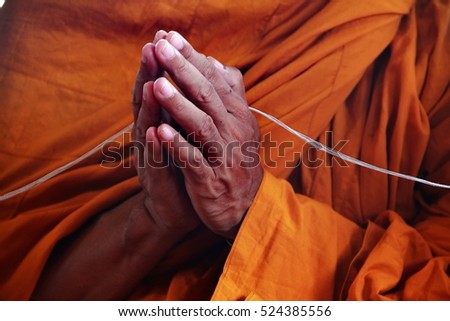 press the hands and  holy thread abstract for worship in buddhism religion