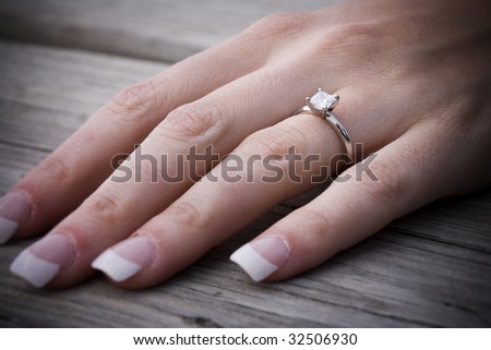 Left hand with engagement ring
