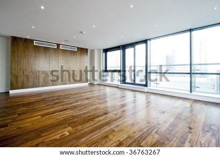 unfurnished penthouse living room with floor to ceiling windows