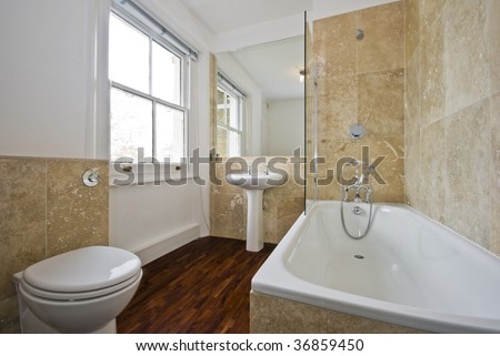 Bathroom With Light Brown Marble Tiles And Wooden Floor Stock ...