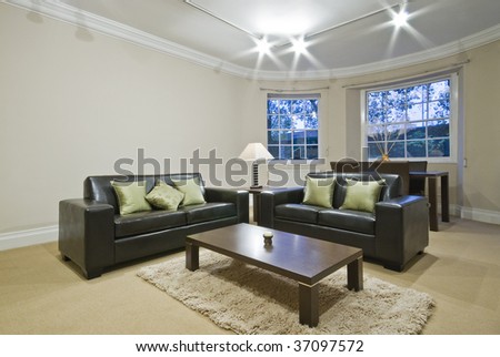 classic living room with oval bay window and dining area