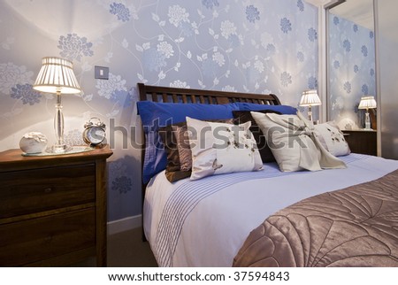 luxury bedroom detail with flower pattern wallpaper