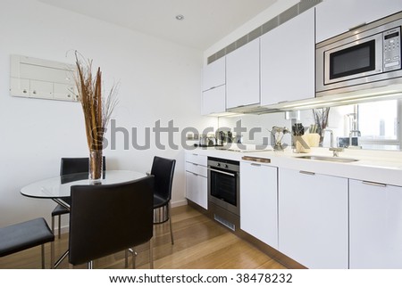 modern bright kitchen with dining table for four