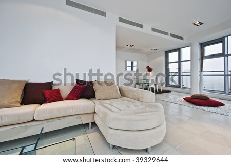 Living Room Area Rugs on Penthouse Living Room With L Shaped Sofa And Dining Area   Stock Photo