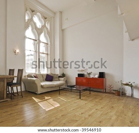high ceiling apartment with large gothic windows