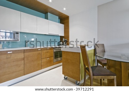 contemporary open plan kitchen with separate work zones and dining table