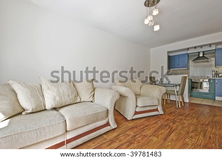open plan living room with massive sofa and dining area