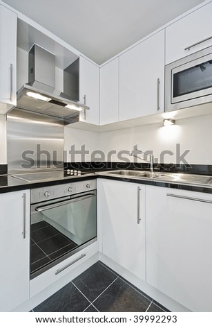 modern kitchen in white whit granite worktop