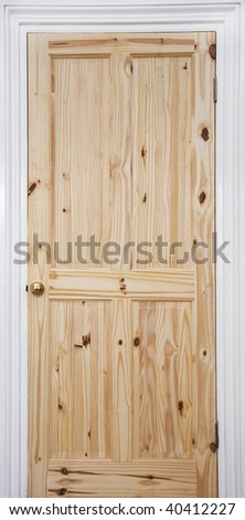 wooden door with white frame and gold plated door knob