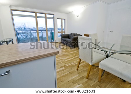 open plan living room with dining table and chairs