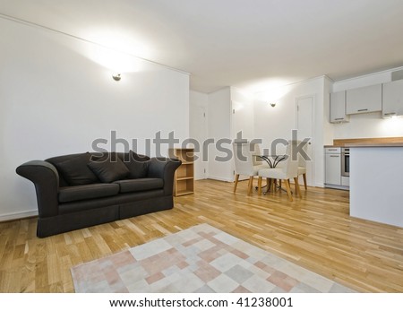 open plan living room with dining table and kitchen counter
