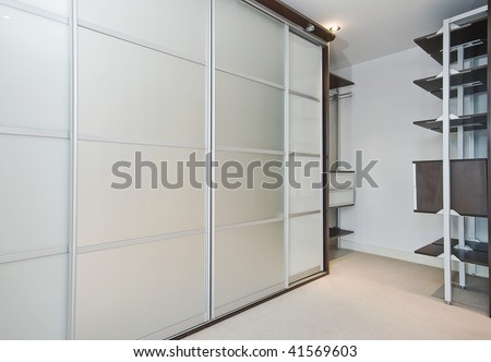 walk in wardrobe with large slide door shrinks and shelf storage