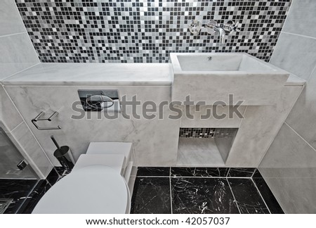 modern luxury bathroom with marble hand wash basin and mosaic tiles