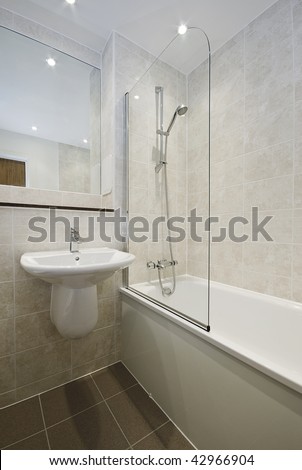 modern bathroom detail with floor to ceiling ceramic tiles