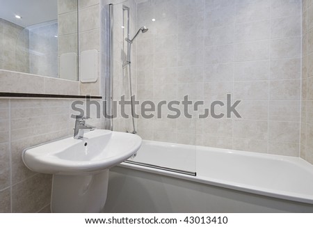 modern bathroom detail with floor to ceiling sand stone tiles