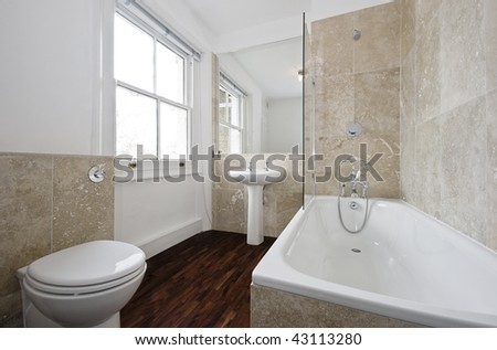 luxury bathroom with white suite and marble tiles