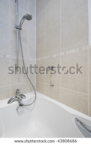 stock-photo-detail-shot-of-a-chrome-water-mixer-tap-with-shower-attachment-43808686.jpg