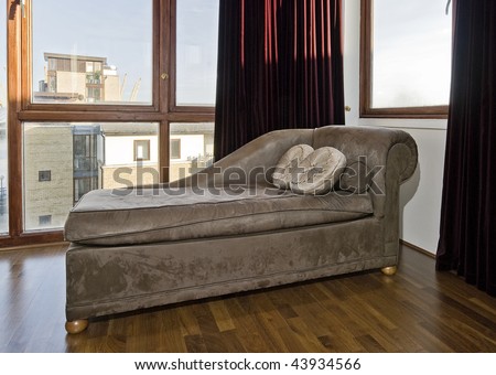 detail of psychiatrist sofa in a room with floor to ceiling window