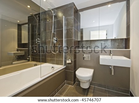 Bathroom Plans on Luxury Bathroom With White Suite And Dark Brown Ceramic Tiles   Stock