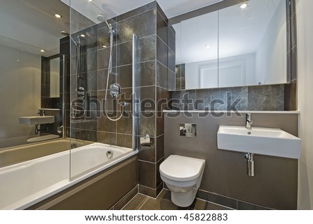 modern luxury bathroom with dark brown floor to ceiling tiles