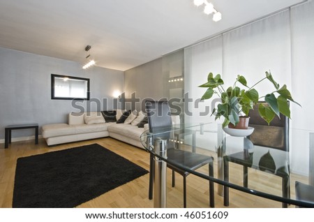 modern luxury living room with leather corner sofa and dining table