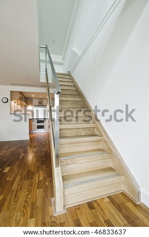 hard wood staircase in a modern luxury duplex apartment