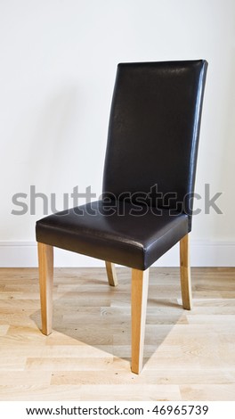 modern luxury designer chair with leather seat and backrest