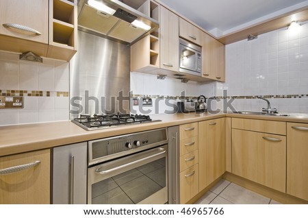 modern kitchen with hard wood unit and worktop