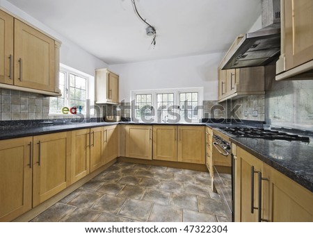 massive cottage style kitchen in wooden finish and granite worktop