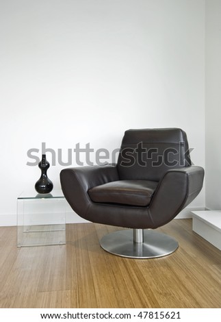 luxury leather armchair with glass side table and decoration