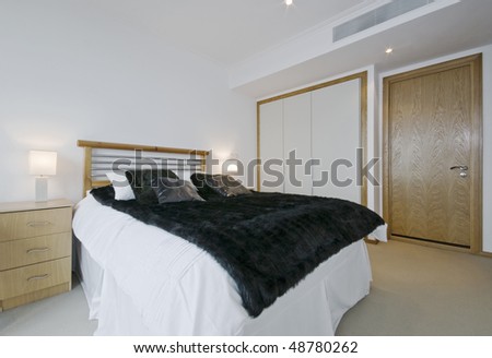modern luxury bedroom with built in wardrobe and air conditioner