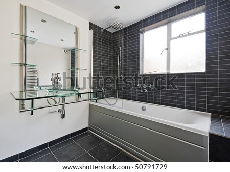 modern stone tiled bathroom with luxury glass hand wash basin