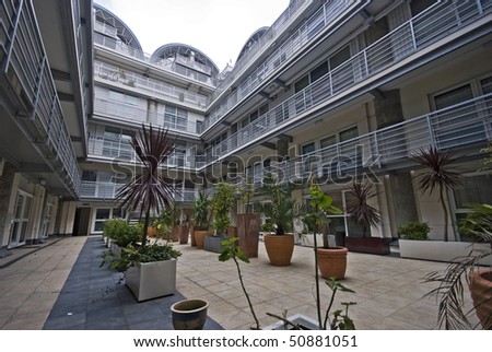 Modern multi level building with atrium and plants