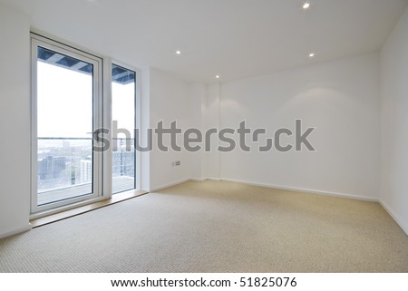 empty unfurnished room with beige carpet floor and balcony access