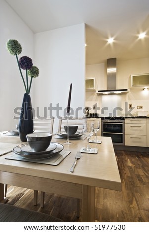 stock photo dining table setup and modern kitchen view