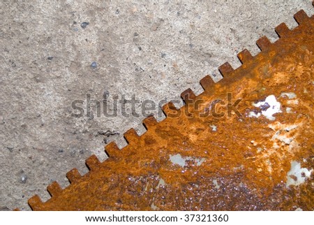 rusty metal piece over the cement floor, diagonal