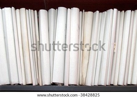 Big pile of old office folders on the shelf