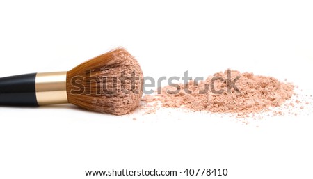 make-up brush with powder on it and heap of powder