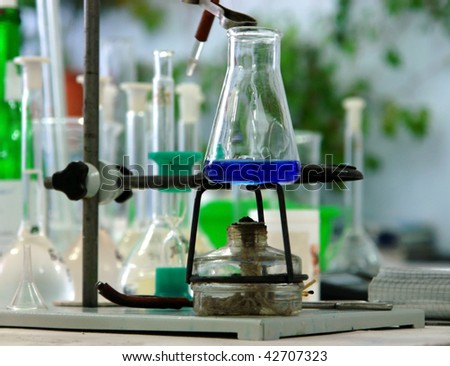 flask filled with blue liquid in a chemistry Lab