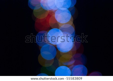 abstract blue and red circles on black background, bokeh effect