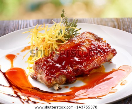 pork ribs in barbecue sauce with potato