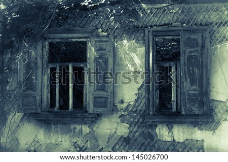Old abandoned haunted house wooden windows with shutters