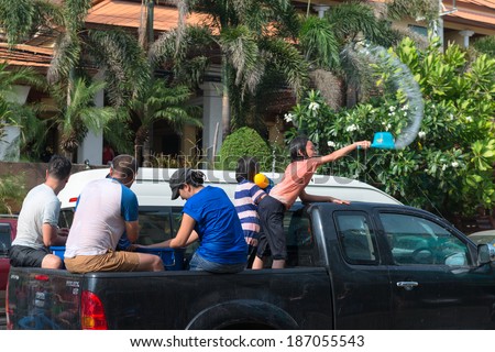 Phuket, Thailand - April 13, 2014: Tourist and residents celebrate Songkran Festival, the Thai New Year by splashing water to each others on Patong streets.